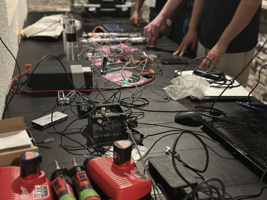 Pit crew working on the rover's electronics